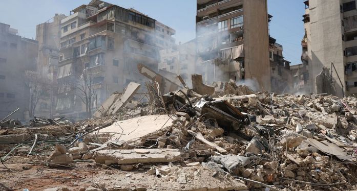 A conceptual image highlighting the Lebanon UN News, showing destroyed buildings with smoke rising in Beirut, alongside the United Nations logo and a call for peace.